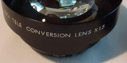 Camera -  Black TV camera Tele Conversion lens 1.5